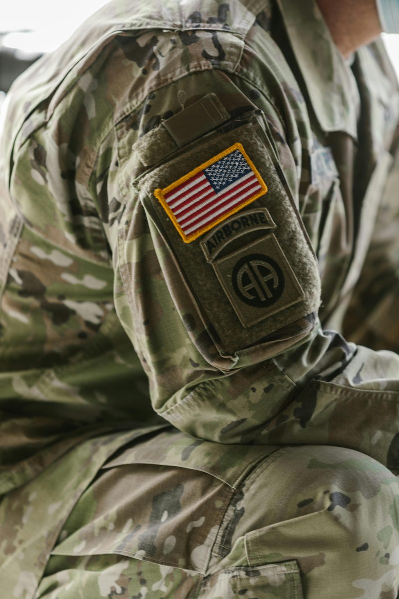 Close-up of a uniform with an American flag and Airborne patch